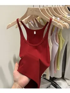 Detail of a red ribbed knit camisole with slim fit design and comfortable texture