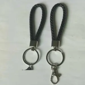 Detailed macro view of black braided PU leather keychains with durable silver metal rings