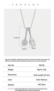 Detailed view of S925 sterling silver spoon and fork necklace with sparkling stones.