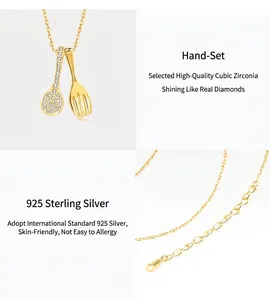 Detail showing hand-set cubic zirconia on a 925 sterling silver spoon pendant