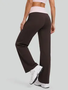 Women's high-waisted yoga pants with contrast pink fold-over waistband in dark brown.