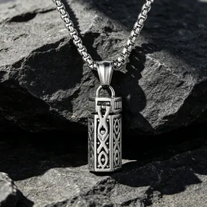 Retro hollow aromatherapy essential oil pendant necklace on natural rock background