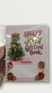 Detailed view of pink spiral-bound Christmas gift card book with festive tree design