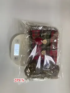 2PCS Christmas wine bottle covers showing weight measurement on a digital scale