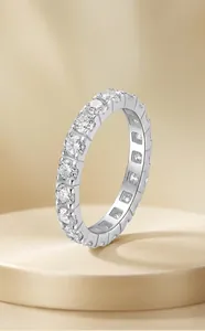 Macro view of an elegant eternity ring featuring sparkling moissanite stones on silver band