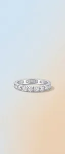 Detailed macro shot of a 925 sterling silver moissanite eternity ring with high sparkle