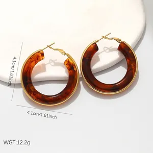 Vintage tortoiseshell resin hoop earrings with premium gold stainless steel frame finish.