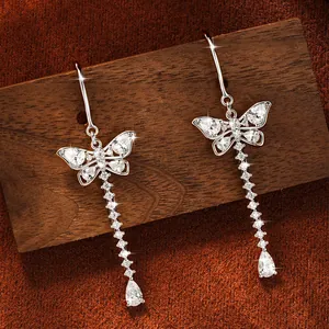 Elegant silver butterfly tassel drop earrings featuring sparkling round moissanite stones