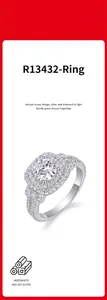 Close-up of S925 silver ring featuring a halo setting with brilliant moissanite stones.