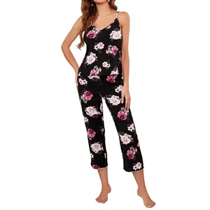 Elegant women's two-piece pajama set with pink rose print on black camisole and pants