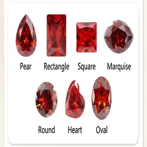 Selection of various faceted red gemstone shapes including pear heart and oval cuts