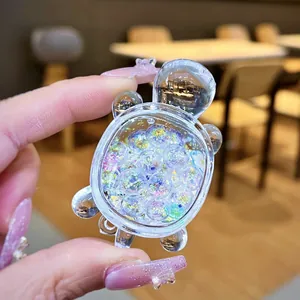 Clear acrylic miniature turtle ornament with colorful glitter quicksand beads