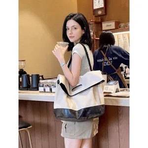 Fashionable cream and black bicolor tote bag with thick rope straps for daily commuting