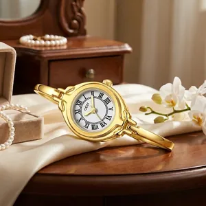 Elegant gold bracelet watch for women with vintage Roman numerals and white dial