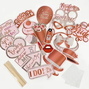 Detailed set of rose gold bachelorette party photo booth props with sticks