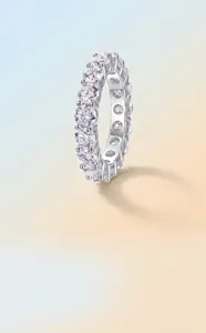 Detail view of sparkling moissanite eternity ring crafted in gold plated 925 silver