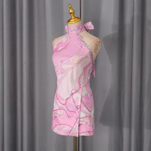 Detail view of pink psychedelic print resort set with halter top and mini skirt