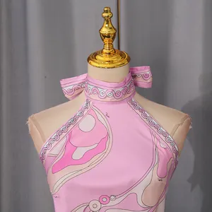 Close-up of pink vacation style halter top with abstract Pucci style wave pattern