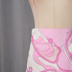 Detailed macro view of abstract pink and white print on a fashionable summer skirt