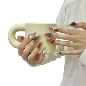 Handmade long press-on nails featuring a retro gradient smudge and butterfly decor