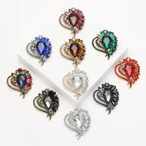 Group of heart-shaped crystal brooches in various colors for elegant styling.