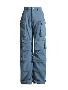 High-waisted washed blue wide-leg denim cargo pants with multiple oversized utility pockets.