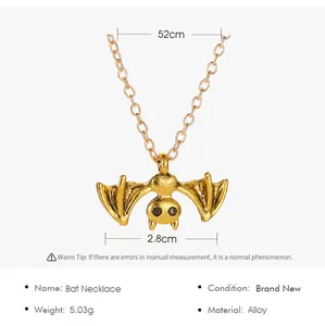 Detailed view of the punk golden bat necklace showing size and material specifications