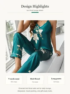 Detail view of emerald green satin bird floral pajama set featuring a V-neck cami top.