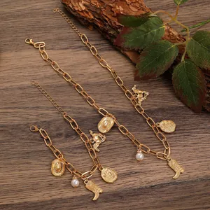 Detailed view of gold-tone western cowboy charm necklace and bracelet set