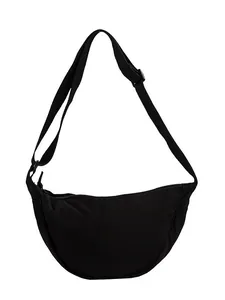 Minimalist black canvas crescent crossbody bag with adjustable strap and zipper closure