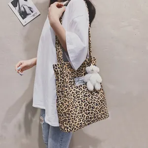 Stylish leopard print tote bag with white bear plush keychain for spring 2026