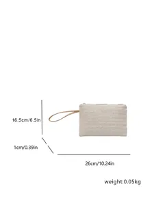 Detailed dimension and weight view of minimalist woven beach straw clutch with wrist strap