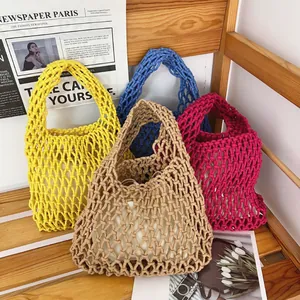 Detailed view of handmade woven cotton rope net bags in various vibrant summer colors.