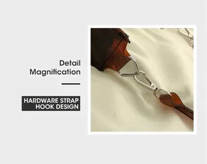 Detailed view of durable silver metal strap buckle on amber transparent jelly bag