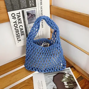 Detailed macro view of the intricate blue hand-woven cotton rope mesh bag texture