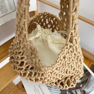 Detail view of handmade woven cotton rope bucket bag featuring a soft inner drawstring pouch