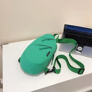 Bright green nylon casual chest bag for commuting and outdoor activities on a desk