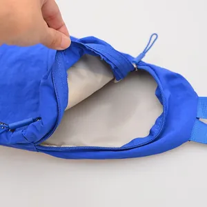 Close-up view showing the durable interior lining and smooth zipper of this blue nylon chest bag