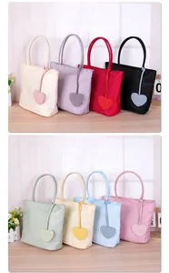 Collection of colorful nylon tote bags with heart charms in various dopamine shades