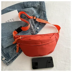 Minimalist red-orange nylon waist bag with woven straps for sport and casual daily outings