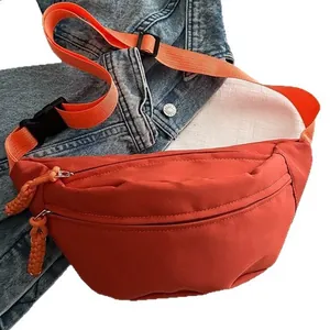 Stylish casual nylon sports waist bag in orange-red with an adjustable crossbody strap