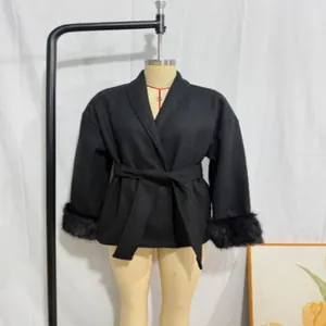 Black wool coat with elegant faux fur cuffs and a matching waist tie belt detail