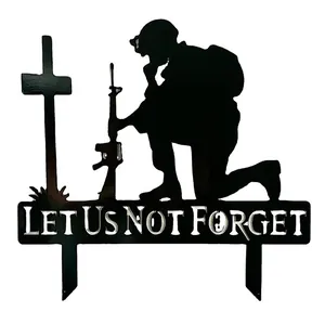 Black metal memorial soldier garden stake with Let Us Not Forget silhouette design