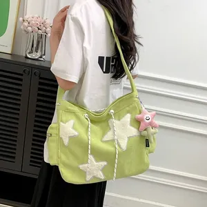 Cute lime green corduroy tote bag for students with plush star patches and keychain