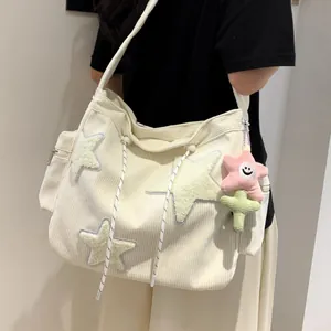 Stylish white corduroy tote bag featuring plush star patches and a large capacity design