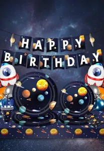Detailed close-up of galaxy themed party supplies set including plates and banner