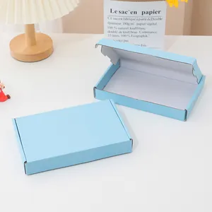Light blue rigid mailing box for packaging in a clean lifestyle setting