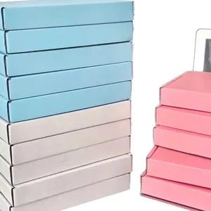 Stack of high-quality colorful cardboard mailing boxes in blue, white, and pink