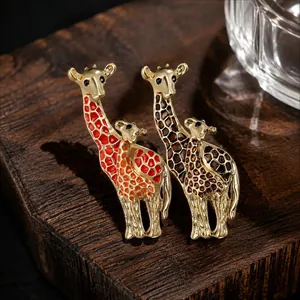 Macro detail of exquisite colorful enamel giraffe brooches on a rustic wood base