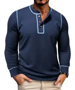 Close-up of navy blue waffle knit long sleeve Henley shirt with light blue contrast trim